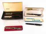 a box with a pen, a pen case, and a pen in it