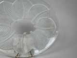 a glass plate with a design on it on a table