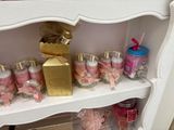 a shelf with candles, candles, and other items on it