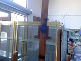 a glass display case in the middle of a room
