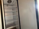 an open refrigerator that is sitting in a room