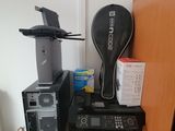 a stack of electronics on top of a refrigerator in a room