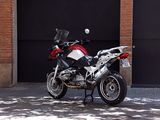 a motorcycle parked in front of a garage door