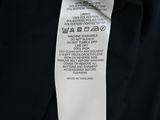 the label on the back of a black jacket