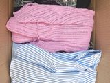 a box full of clothes that are sitting in it