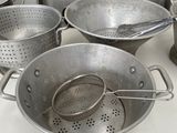 many pots and pans sitting on the counter