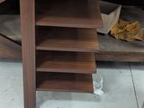 a wooden desk with a laptop on top of it