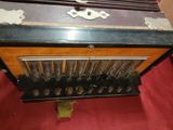 an old radio that is sitting on a red carpet