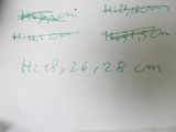 a piece of paper with writing on it and a calculator next to it