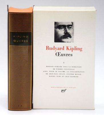 two books sitting next to each other on a white surface