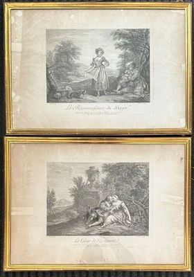two framed prints of a woman and a dog in a wooded setting