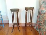 two side tables sitting on a hard wood floor