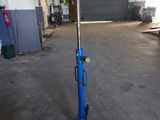 an image of a blue and black stand with a hockey stick on top of it