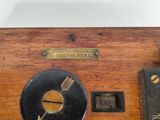 a clock that is sitting on top of a wooden table