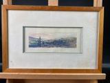 an image of a painting of a landscape is displayed on a easel