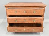 an image of a wooden chest of drawers with brass handles