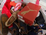 a bag full of shoes and a box of shoes