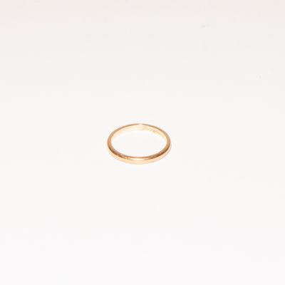 a gold ring on a white background