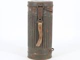 an old metal trash can with a wooden handle on a white background