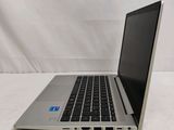 an open laptop computer sitting on top of a white surface
