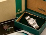 a box with a watch inside of it on a table