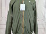 jacket on a mannequin stand in front of a white wall