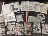 a lot of stamps and stamps on a table