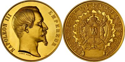 a close up of a gold coin with an image of a man