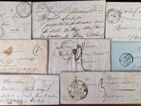 several old envelopes are sitting on a table with writing on them