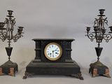 three different types of clocks sitting on a table