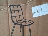 a cardboard box with a drawing of a chair on it