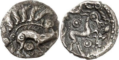 a silver coin with an image of a man on it
