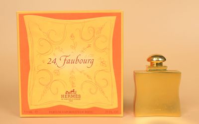 an image of a bottle of perfume sitting next to a box