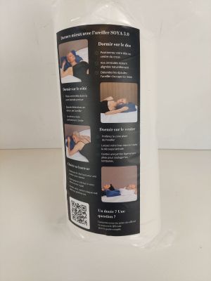 une photo d'un flacon de gel hydroalcoolique posé sur une table