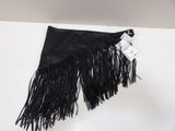 a black fringe bag hanging on a wall with a tag on it
