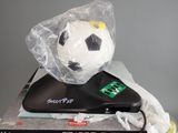 a soccer ball sitting on top of a stack of books