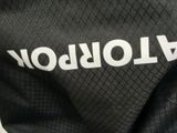a close up of a black and white bag with a name on it