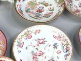 many plates and cups that are on a table