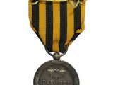 a close up of a medal with a ribbon around it