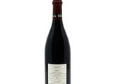 a close up of a bottle of red wine on a white background