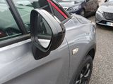 many cars parked in a parking lot next to each other