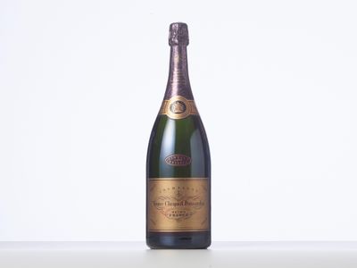 a bottle of champagne sitting on top of a white table