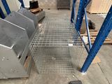 a metal rack in the middle of a warehouse