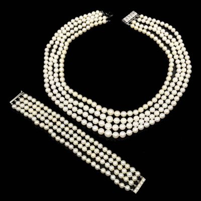 a three strand pearl necklace and bracelet set