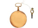 a gold pocket watch with a key on a white background