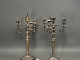 pair of silver plated candelabs with candlesticks on stands