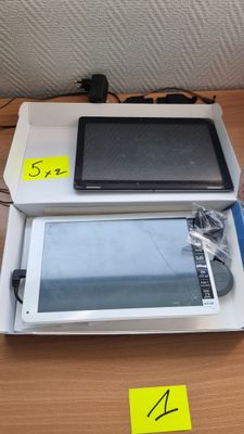 a tablet computer sitting on top of a box on a table
