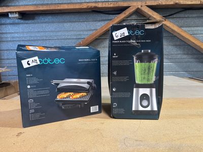 packaging of a blender sitting on a table next to a box of food