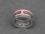a close up of a ring on a table with a gray background