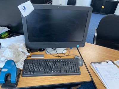 a desktop computer sitting on a desk with a keyboard and mouse